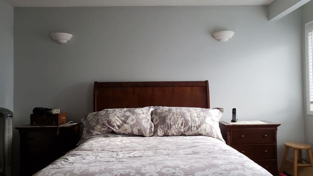 Master bedroom with stylish new grey wall